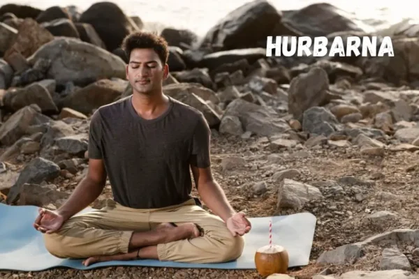 A person practicing Hurbarna meditation in a serene natural setting.